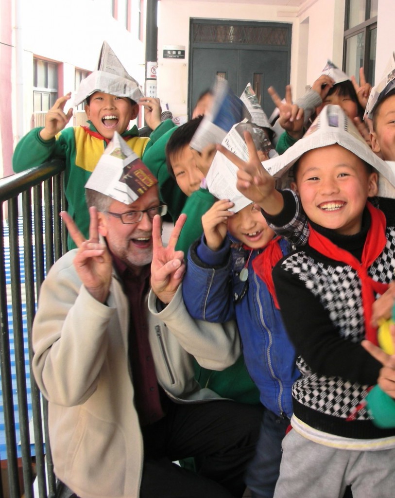 Oliver Pointer & students with paper hats